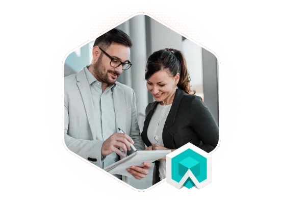 a man and a woman in smart clothing looking at work