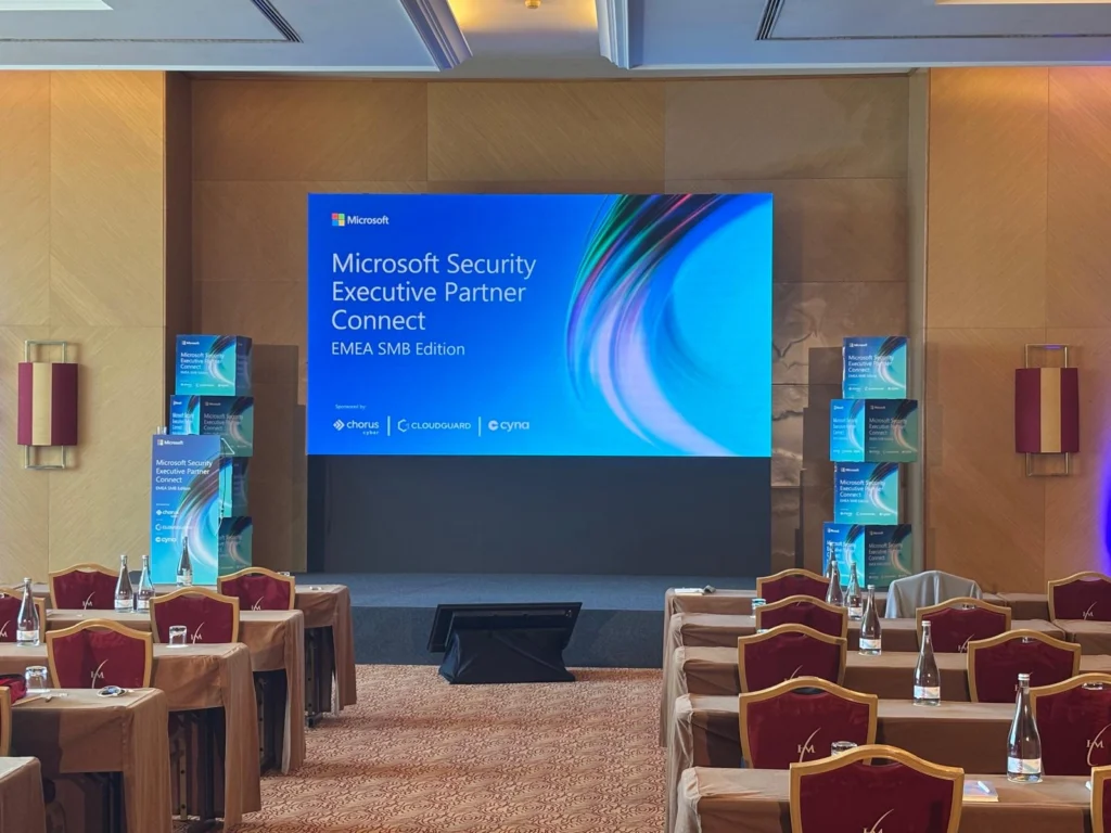 Screen in conference room displaying Executive Partner Connect