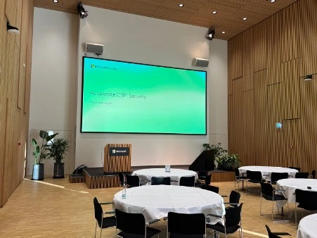 A screen with a presentation in a conference room